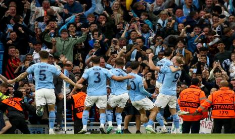 Para pemain Manchester City merayakan gol ke gawang Real Madrid pada leg kedua semifinal Liga Champions.