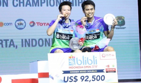 Pasangan ganda campuran Indonesia, Tontowi Ahmad/Liliyana Natsir menjuarai turnamen Blibli Indonesia Open 2018 Super 1000, Ahad (8/7).