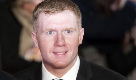 Paul Scholes berharap Manchester United (MU) meraih empat gelar musim ini.