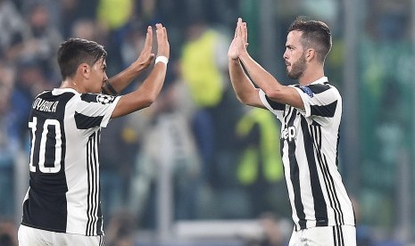 Paulo Dybala (kiri) dan Miralem Pjanic (kanan).