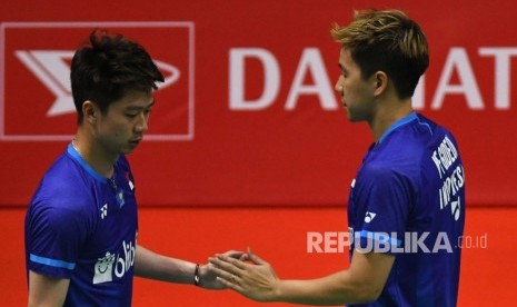 Pebulu tangkis ganda putra Indonesia Kevin Sanjaya Sukamuljo (kiri) berselebrasi dengan rekannya Marcus Fernaldi Gideon.