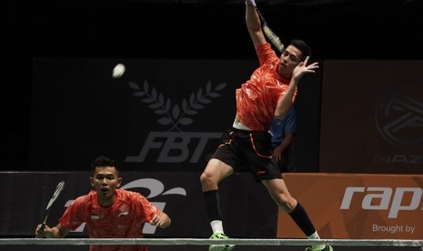 Pebulu tangkis ganda putra Indonesia Muhammad Rian Ardianto (kanan) yang berpasangan dengan Fajar Alvian. Timnas bulu tangkis Indonesia akan menurunkan empat wakilnya yang akan bermain di tiga nomor dalam babak final turnamen BWF Super 500 Singapore Open 2022, Ahad (17/7/2022).