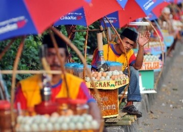 Pedagang kerak telor. (ilustrasi)