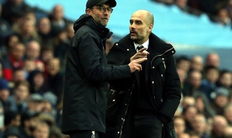 Pelatih Liverpool, Juergen Klopp (kiri) dan pelatih Manchester City, Pep Guardiola.