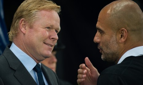 Ronald Koeman (kiri) dan Pep Guardiola.