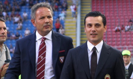 Pelatih Torino, Sinisa Mihajlovic (kiri) dan pelatih AC Milan, Vicenzo Montella pada laga Serie A, di stadion San Siro, 21 Agustus. Dua pelatih ini dianggap berjasa menggenjot prestasi bintang muda Milan.