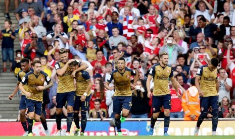 Pemain Arsenal melakukan selebrasi setelah mencukur Lyon 6-0, Sabtu (25/7)