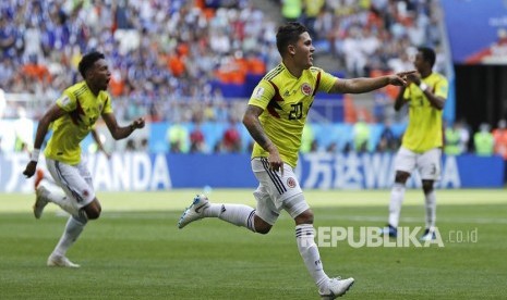 Pemain Kolombia Juan Quintero merayakan  gol ke gawang Jepang di Saransk, Rusia, Selasa (19/6).   