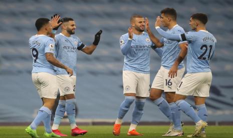 Pemain Manchester City merayakan gol ke gawang Burnley.