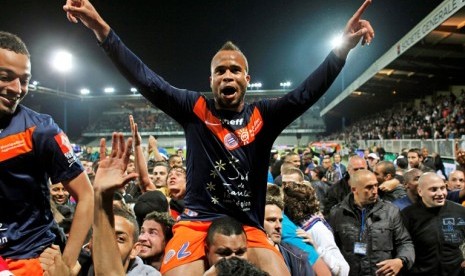 Pemain Montpellier, Garry Bocaly merayakan gelar juaga liga Prancis 2011/2012