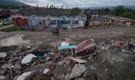 Pemandangan bekas pencairan tanah atau likuefaksi di Kelurahan Balaroa, Palu, Sulawesi Tengah, Selasa (4/6/2019).