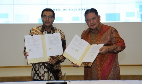 Penandatanganan Kerja Sama Pelayanan Jasa Kustodian yang ditandatangani oleh Direktur Utama PT TASPEN (PERSERO), Iqbal Latanro dan Direktur Utama PT BANK RAKYAT INDONESIA (PERSERO), Tbk, Suprajarto.