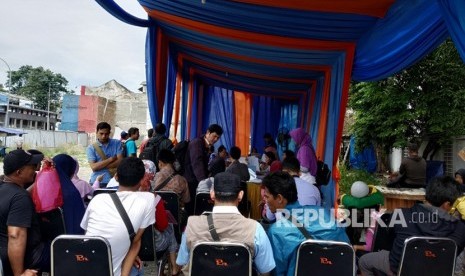 Pendaftaran motor mudik gratis lebaran 2019 yang berlokasi di samping Stasiun Jatinegara, Jakarta Timur, Kamis (15/3).