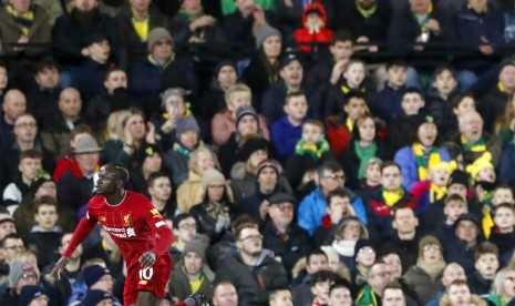 Penyerang Liverpool Sadio Mane mencetak gol untuk The Reds pada laga melawan Norwich City. Liverpool menang 1-0 pada laga Ahad dinihari.