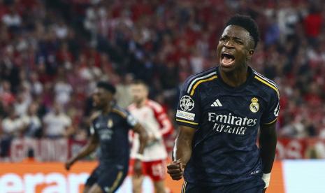 Penyerang Real Madrid Vinicius Junior merayakan golnya ke gawang Bayern Munchen di Liga Champions.