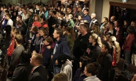 People attend a community vigil at the Grove Church following a shooting at Marysville-Pilchuck High School in Marysville, Washington October 24, 2014.