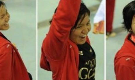 Perenang Indonesia, Yessy Yossaputra, mengekspresikan kegembiraannya usai menyabet emas di nomor 200 meter gaya punggung putri di Stadion Aquatic Centre Jakabaring dalam SEA Games XXVI, Palembang, Sumatera Selatan, Minggu (13/11). 