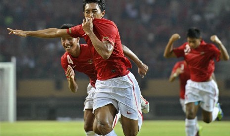  Pesepakbola Indonesia, Nurmufid, melakukan selebarasi usai mencetak gol ke gawang Timor Leste dalam pertandingan kualifikasi Grup E Piala Asia (AFC) di Pekanbaru, Riau, Sabtu (7/7) malam. 