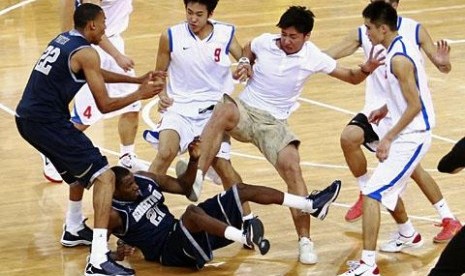  Players from American Georgetown University men's basketball team and China's Bayi men's basketball team fight during a friendly game at the Beijing Olympic Basketball Arena on Aug. 18, 2011 (illustration)