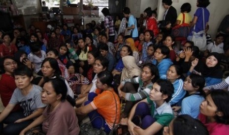 Police rescue at least 161 women from a house in Bekasi, West Java before they are sent abroad as illegal workers.