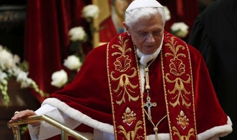 Pope Benedict XVI leaves at the end of a mass at the St. Peter's Basilica in the Vatican February 9, 2013. Pope Benedict will step down as head of the Catholic Church on Feb. 28, the Vatican confirmed on February 11, 2013. 