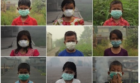 Potret anak-anak mengenakan masker selama kabut asap di Kalimantan.