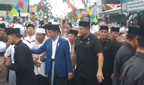 President Joko Widodo (Jokowi) attends the 13th death anniversary of Kiai Haji Muhammad Zaini Bin Abdul Ghani or Abah Guru Sekumpul at Kelurahan Sekumpul, Banjar district, South Kalimantan, on Sunday (March 24).