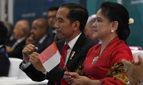 President Joko Widodo (second right) and First Lady Iriana Joko Widodo attend opening ceremony of the 18th Asian Games at Gelora Bung Karno Main Stadium, Jakarta, Saturday.