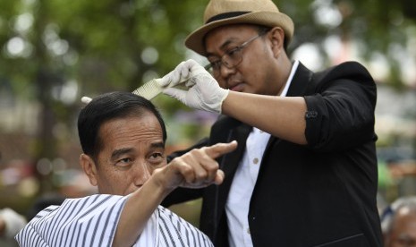 President Joko Widodo (left)