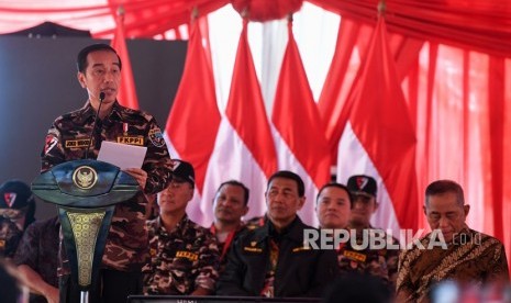 President Joko Widodo delivers a speech when   during the opening of the National Jamboree of the Indonesian National Police's Son Daughter Communication Forum (FKPPI) at Ragunan Campground, Jakarta, Friday.