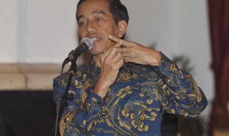 Presiden Joko Widodo menyampaikan pidato pada malam peringatan Hari Film Nasional di Istana Negara, Jakarta, Senin (30/3).