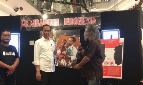 Presiden Jokowi saat menghadiri pameran foto 