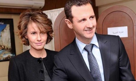 Presiden Suriah Bashar Al-Assad (kanan) dan istrinya Asma Al-Assad (kiri).