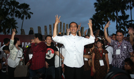 President-elect Joko Widodo (center) attends a celebration among his supporters in Jakarta on Wednesday.