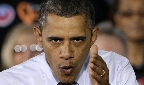 President Barack Obama gestures as he speaks to workers about the economy during a visit to Daimler Detroit Diesel in Redford, Mich. A new North Korean video portrays President Barack Obama and American troops in flames and says the North conducted its rec