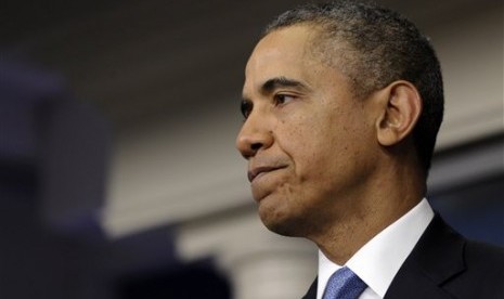 President Barack Obama pauses while speaksing about Ukraine, Monday, March 17, 2014, in the James Brady Press Briefing Room at the White House in Washington. 