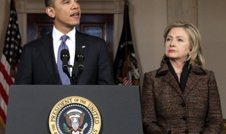 President Barack Obama, with Secretary of State Hillary Rodham Clinton at right, speaks about Libya in the Grand Foyer of the White House in Washington. Obama now has a freer hand to deal with a world of familiar problems in fresh ways. Clinton has announc