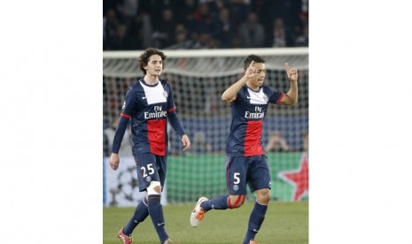 PSG's Marquinhos, right, celebrates his goal with PSG's Adrien Rabiot during the Champions League round of 16 second leg soccer match between Paris Saint Germain and Bayer Leverkusen at the Parc des Princes stadium in Paris, Wednesday, March 12, 2014