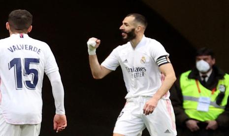 Reaksi Benzema usai menyelamatkan Real Madrid dari kekalahan di kandang Atletico, Senin (8/3) dini hari WIB.