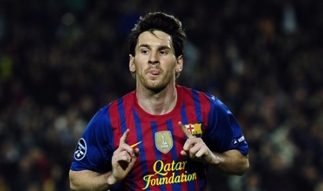 Reaksi Lionel Messi (FC Barcelona) setelah mencetak gol ke gawang AC Milan, di Camp Nou, Barcelona, Spanyol, Selasa (3/4). (Foto: AP/Manu Fernandez) 