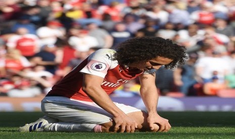  Reaksi pemain Arsenal Matteo Guendouzi dalam pertandingan melawan Crystal Palace di Emirates Stadium di London