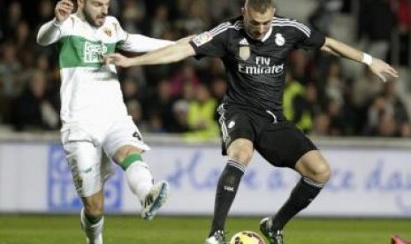 Duel Real Madrid melawan Elche pada lanjutan La Liga Spanyol, Senin (23/2) dinihari WIB..