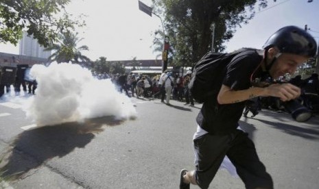 Riot policemen fire tear gas against demonstrators during a protest against the 2014 World Cup in Sao Paulo June 12, 2014. 