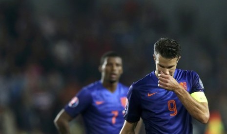 Robin van Persie of the Netherlands reacts after the Euro 2016 qualifying soccer match against the Czech Republic in Prague September 9, 2014.