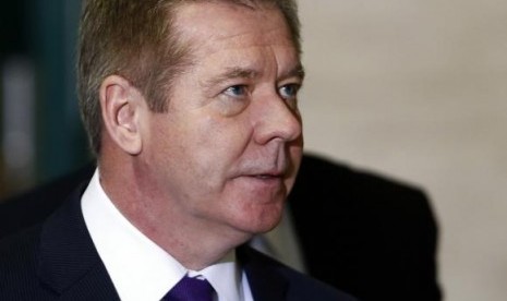 Russia's Deputy Foreign Minister Gennady Gatilov arrives for a meeting on Syria at the United Nations' European headquarters in Geneva February 13, 2014.