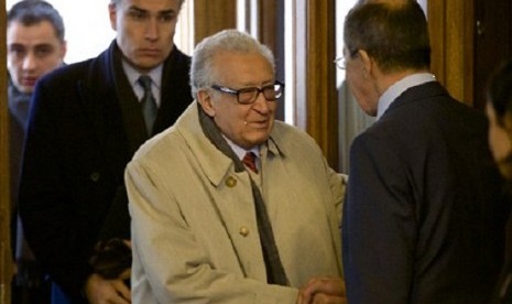 Russian Foreign Minister Sergey Lavrov,right, and UN envoy for Syria, Lakhdar Brahimi, center, shake hands as they meet in Moscow, Russia, on Saturday, Dec. 29, 2012. (illustration)  