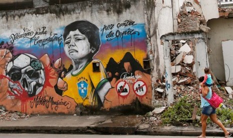 Salah satu seni grafiti yang menggambarkan kemarahan warga Brasil terhadap Piala Dunia 2014.