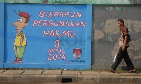 Sebuah mural bertemakan pemilu bertuliskan 