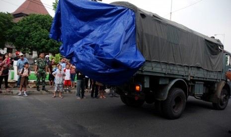 The wreckage of Bravo 202, an airplane with two side by side seats, is loaded into a military truck in Bandung, West Java, on Saturday.  