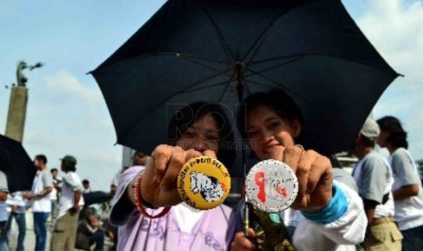  Sejumlah elemen masyarakat melakukan aksi kampanye anti-HIV&Aids; (ilustrasi).Perilaku seks menyimpang seperti LGBT semakin terang-terangan